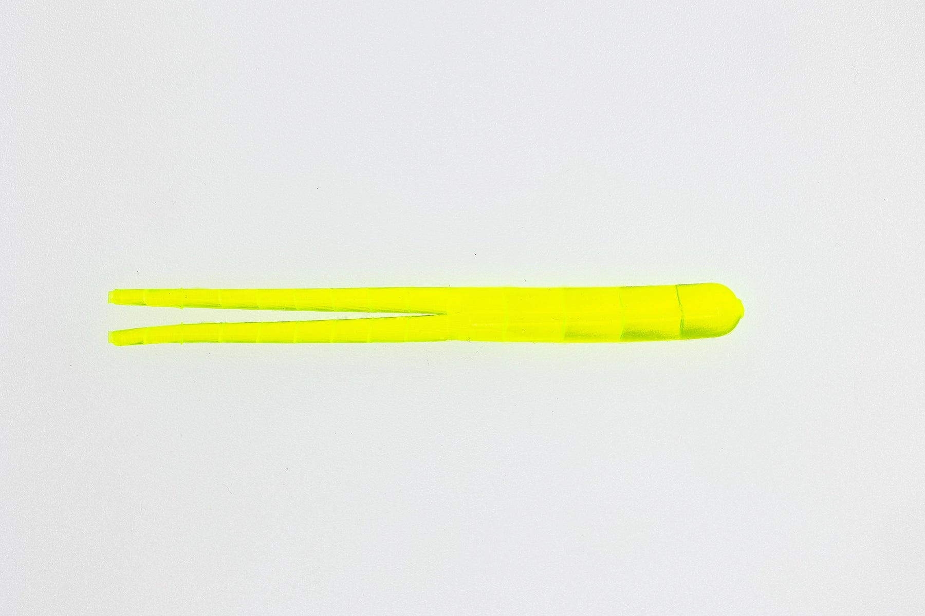Two yellow chopsticks on a light gray background